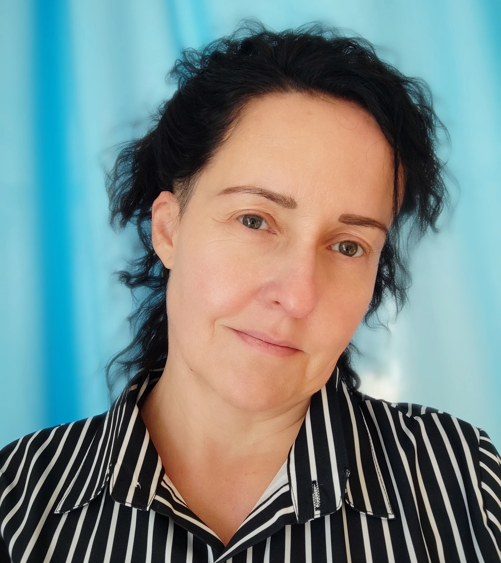 Psychologist Marta Korsak in a calm professional portrait.